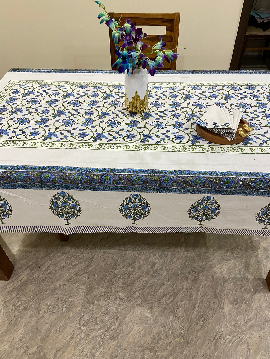 Decorative tablecloth with blue and white floral patterns