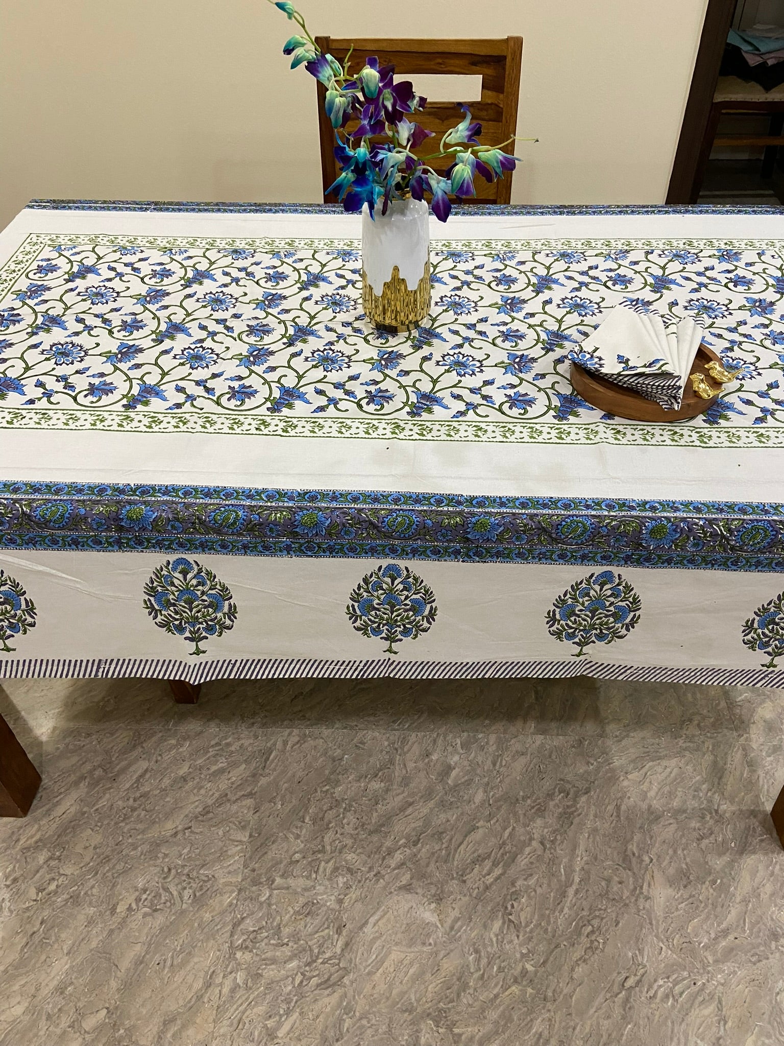 Decorative tablecloth with blue and white floral patterns